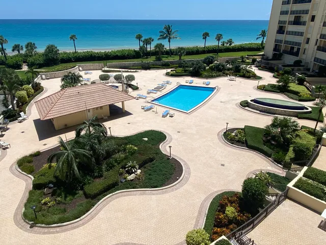 a view of a swimming pool with a patio