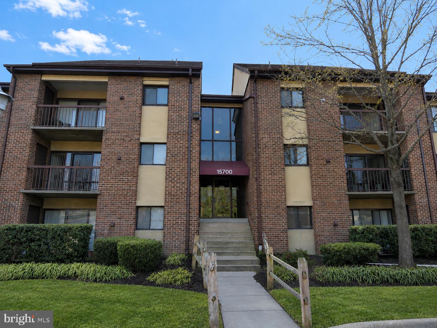 15700 Dorset Road, Unit 120 Laurel, MD 20707 - Photo 1 of 1 a front view of a house with a yard