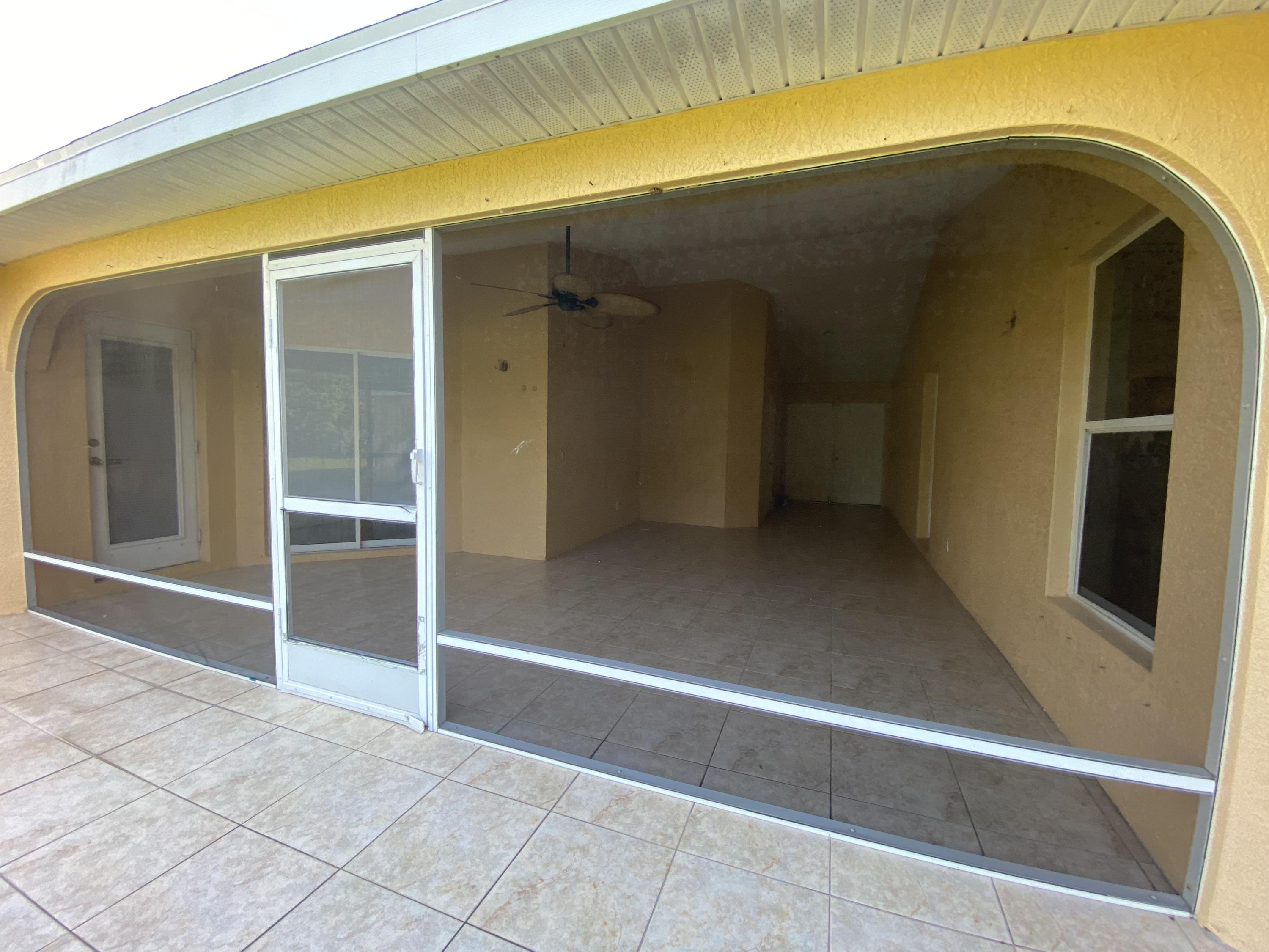 3504 Southwest Macon Road Port St. Lucie, FL 34953 - Photo 13 of 15 Rear View / Patio Area