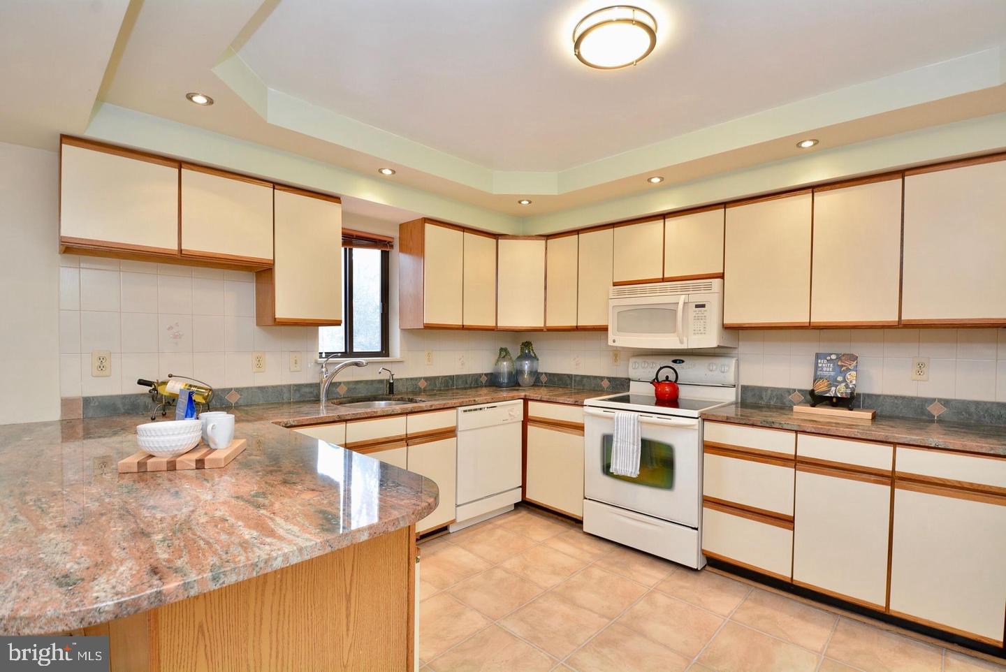 8421 Alvin Road Pasadena, MD 21122 - Photo 16 of 54 a kitchen with a sink cabinets and window