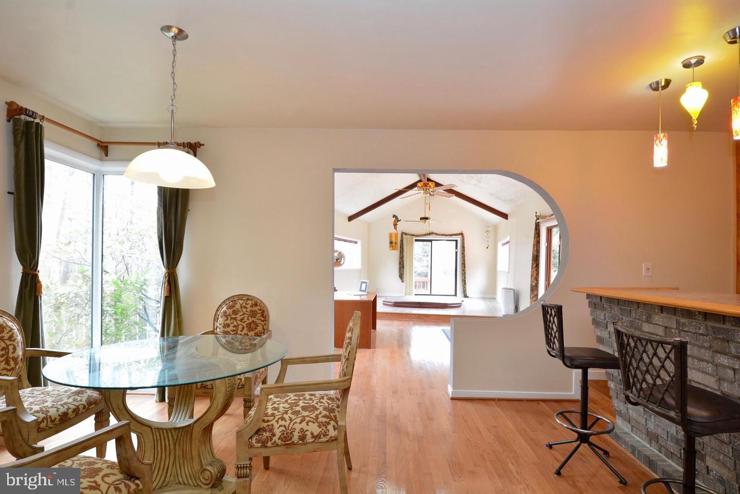 8421 Alvin Road Pasadena, MD 21122 - Photo 17 of 26 a view of a dining room with furniture and chandelier