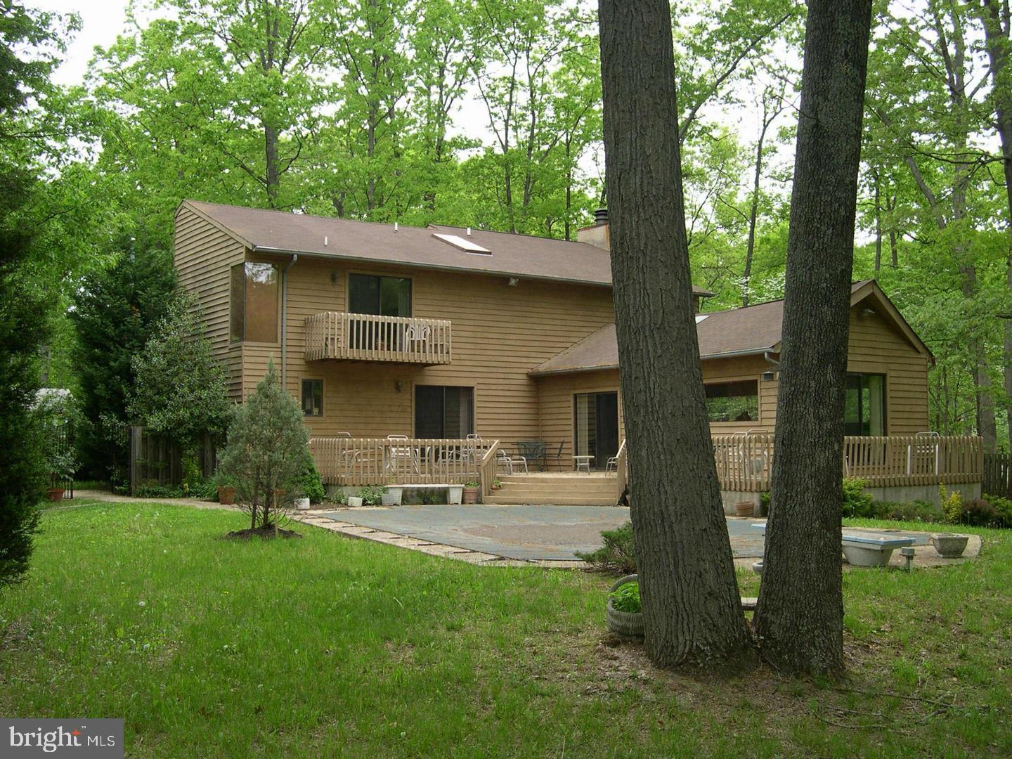 8421 Alvin Road Pasadena, MD 21122 - Photo 2 of 26 a backyard of a house with seating space