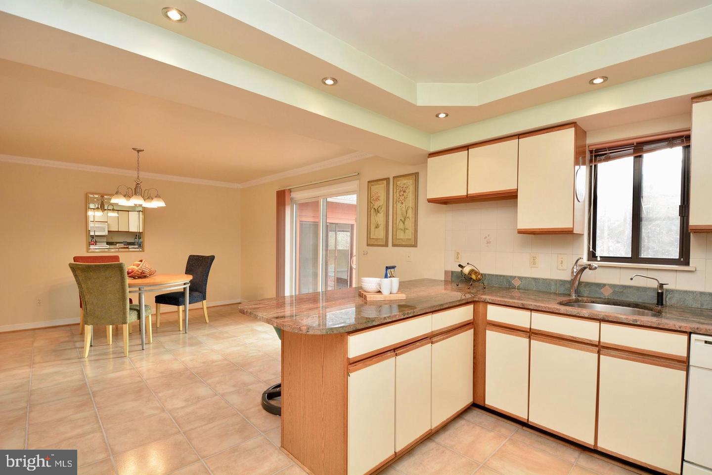 8421 Alvin Road Pasadena, MD 21122 - Photo 21 of 54 a kitchen with a sink and cabinets