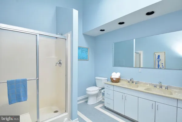 a view of an empty room with window and closet