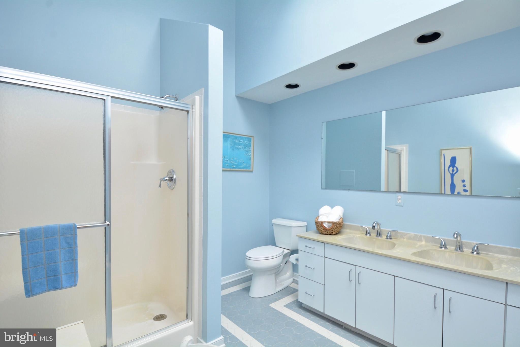 8421 Alvin Road Pasadena, MD 21122 - Photo 23 of 26 a bathroom with a granite countertop sink toilet and shower