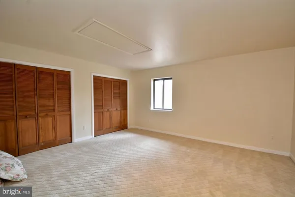 a bathroom with a sink mirror vanity and toilet