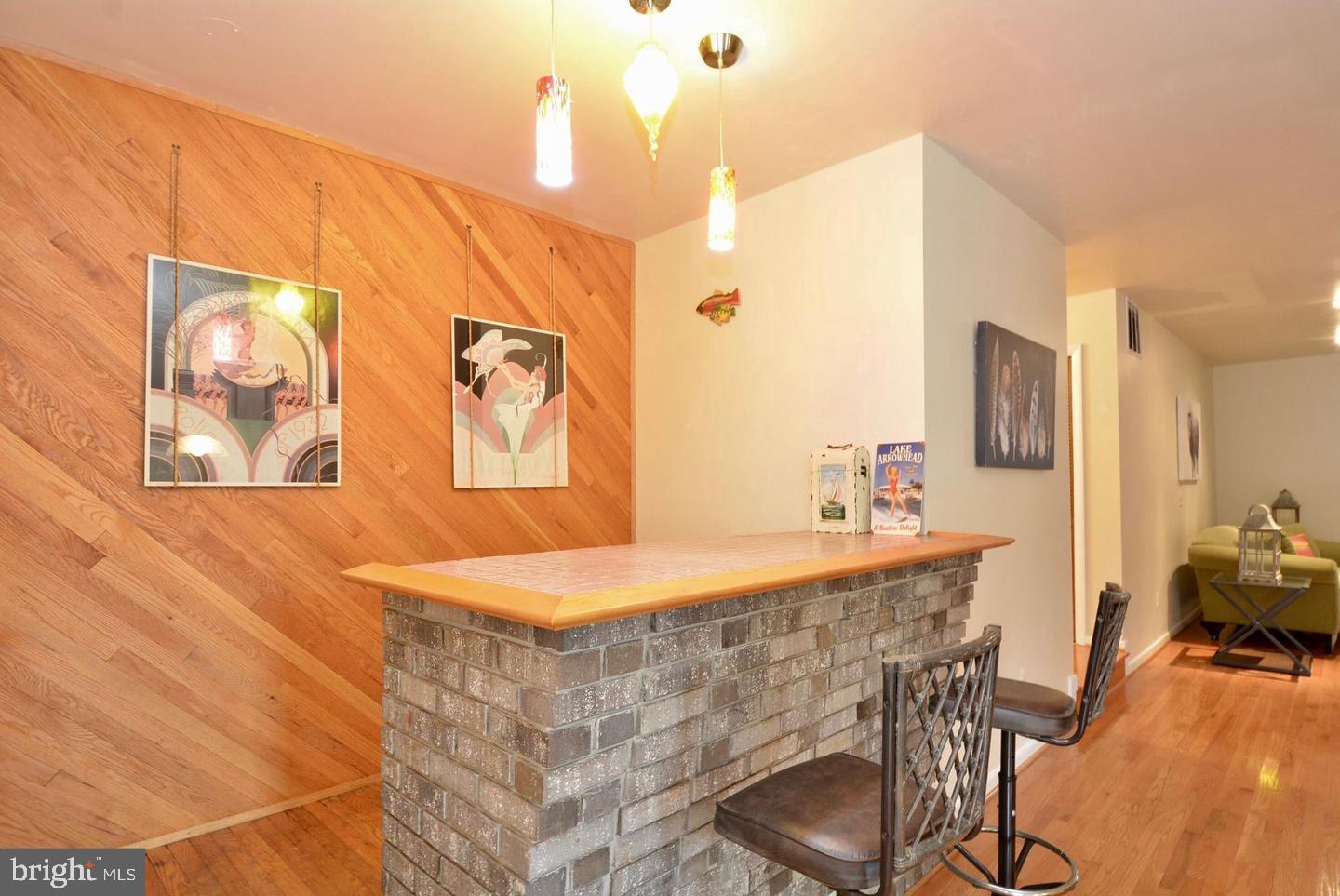 8421 Alvin Road Pasadena, MD 21122 - Photo 28 of 54 a dining room with a sink and breakfast area