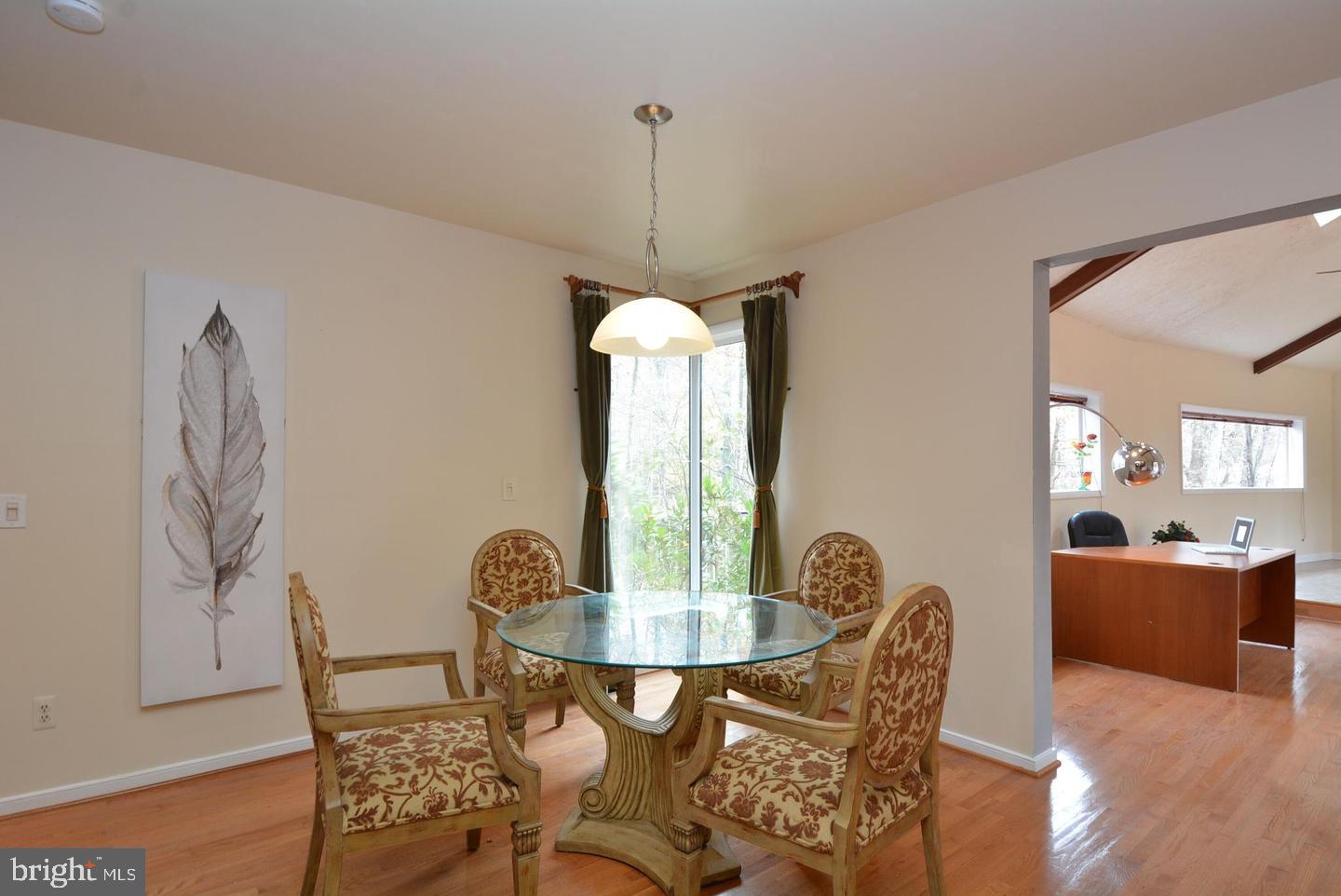8421 Alvin Road Pasadena, MD 21122 - Photo 30 of 54 a dining room with furniture and window
