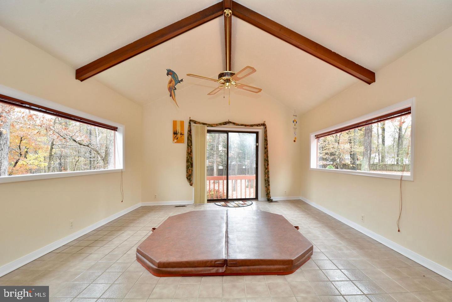 8421 Alvin Road Pasadena, MD 21122 - Photo 34 of 54 a view of a livingroom with a ceiling fan and window
