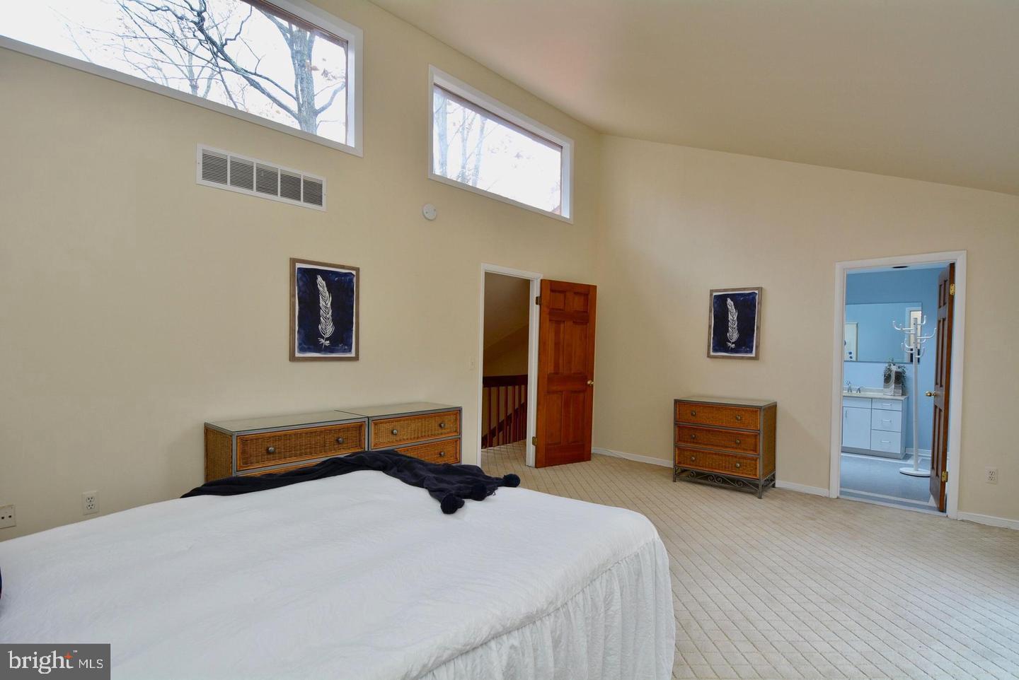 8421 Alvin Road Pasadena, MD 21122 - Photo 39 of 54 a bedroom with a bed and dresser