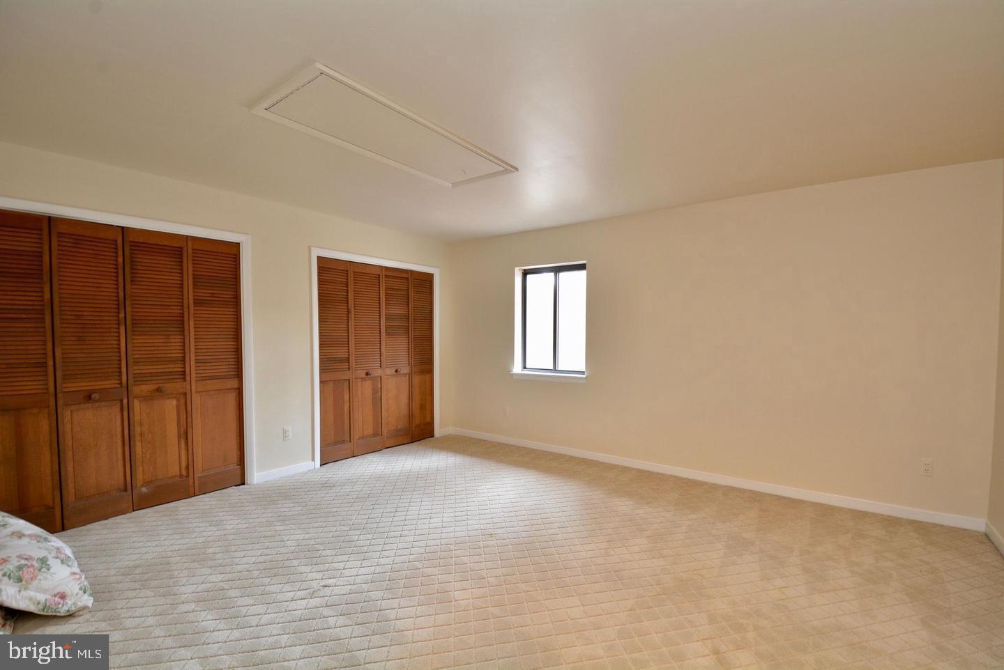 8421 Alvin Road Pasadena, MD 21122 - Photo 44 of 54 a view of an empty room with window and closet