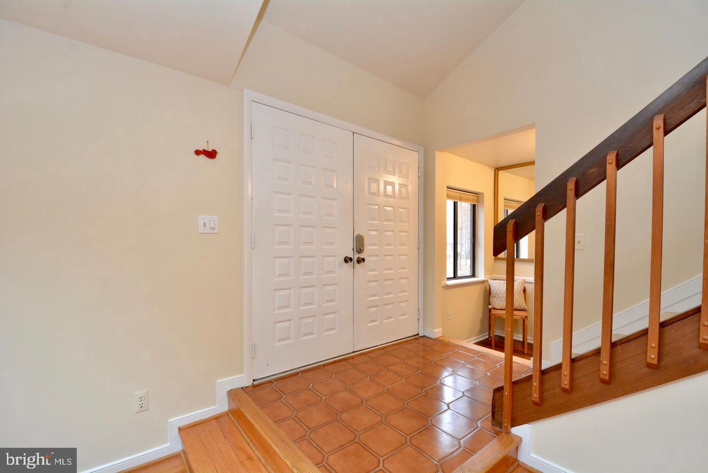 8421 Alvin Road Pasadena, MD 21122 - Photo 5 of 54 a view of a bedroom with wooden floor and windows