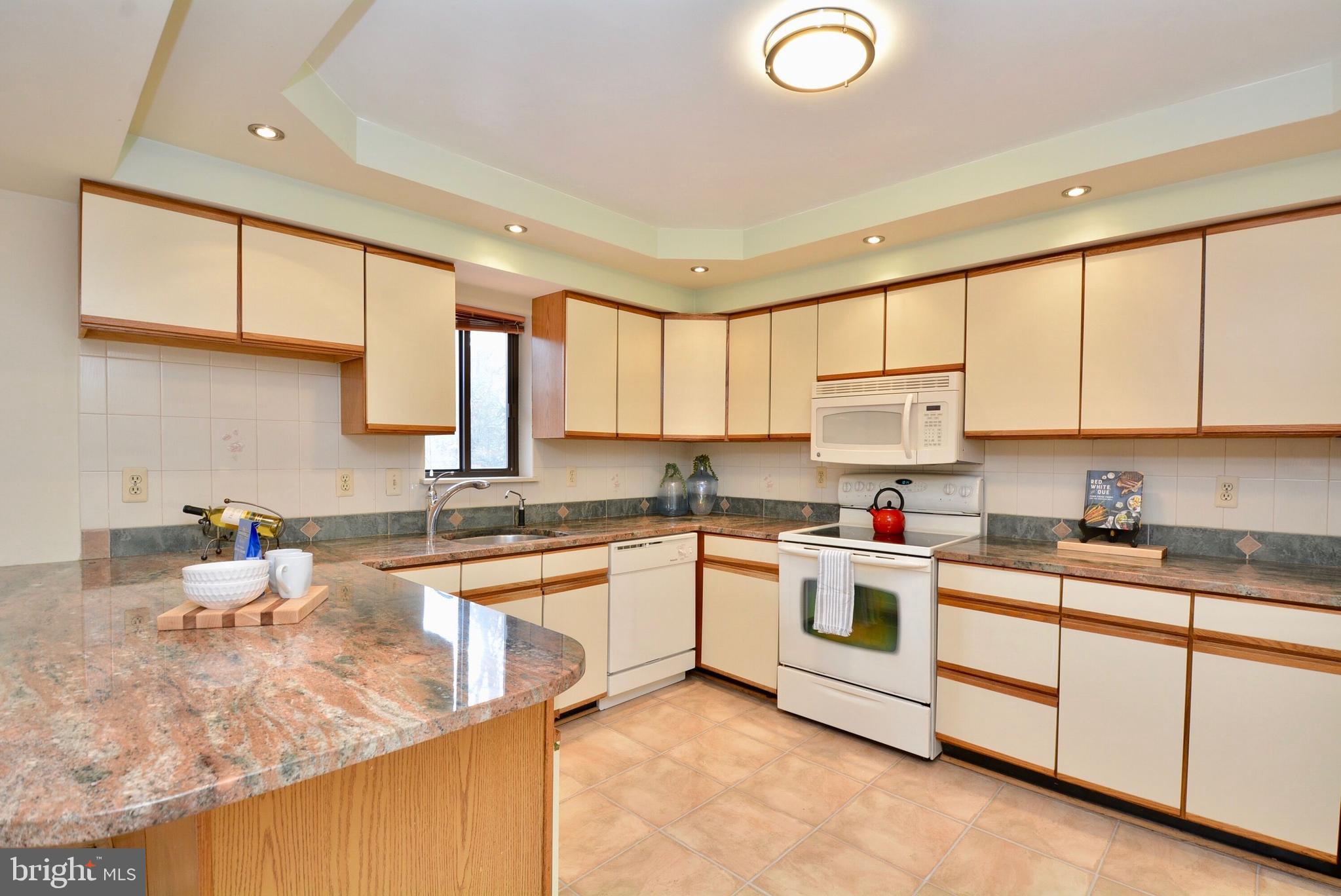8421 Alvin Road Pasadena, MD 21122 - Photo 9 of 26 a kitchen with a sink cabinets and window