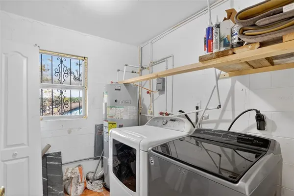 a utility room with dryer and washer