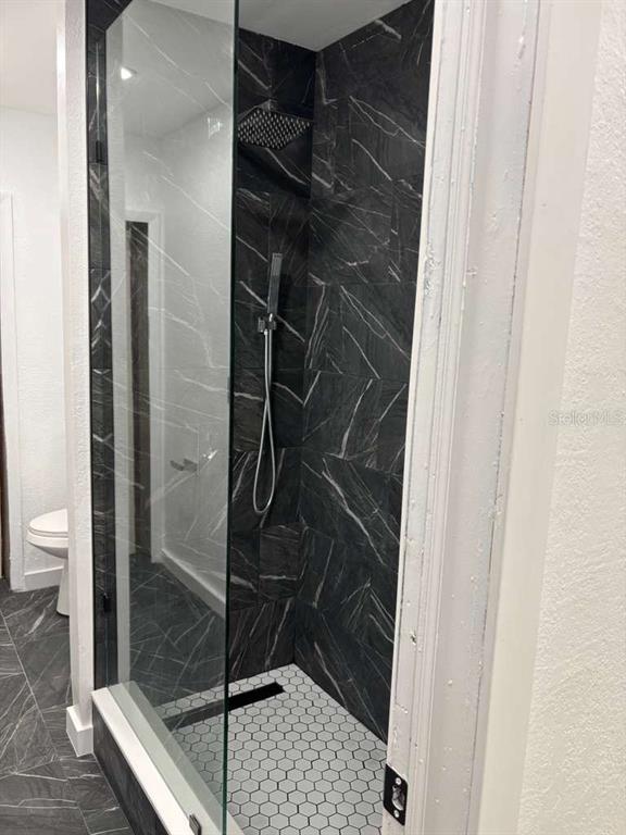 101 West Celeste Street Apopka, FL 32703 - Photo 26 of 47 a bathroom with a shower and toilet