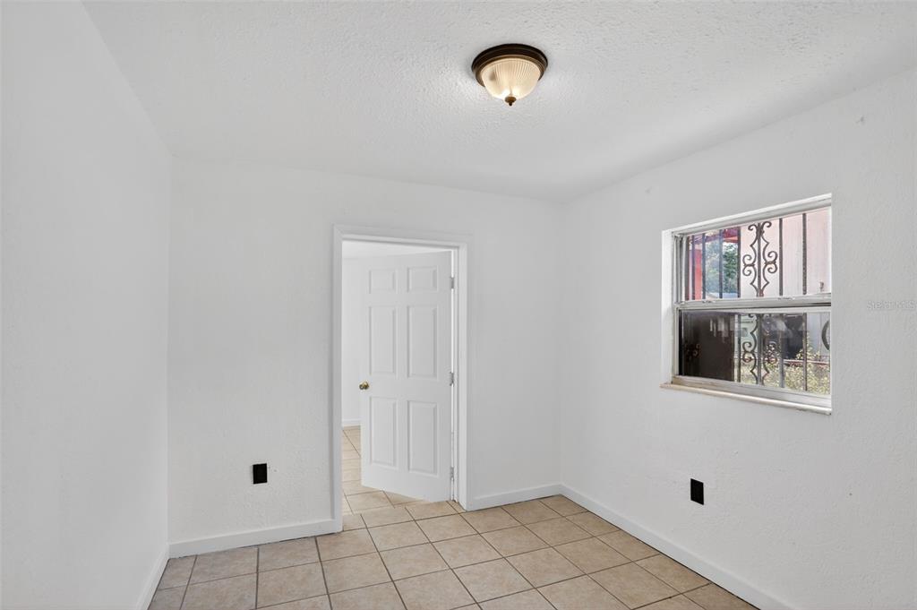 101 West Celeste Street Apopka, FL 32703 - Photo 29 of 47 a view of an empty room with a window