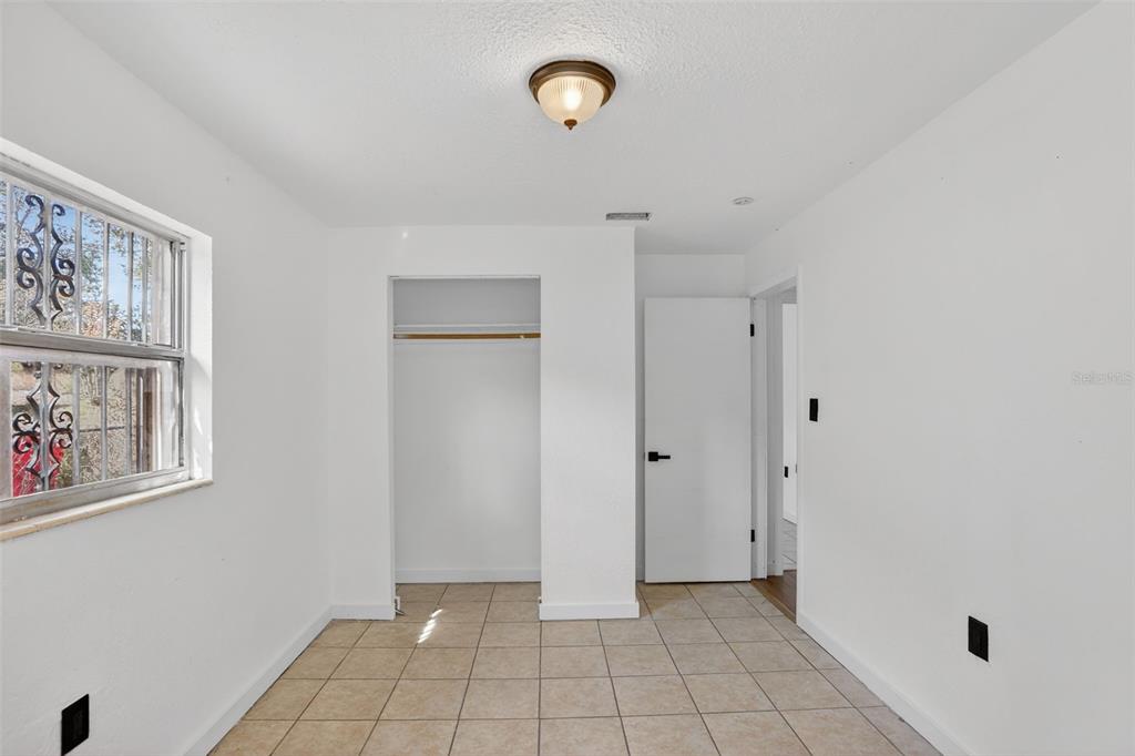 101 West Celeste Street Apopka, FL 32703 - Photo 30 of 47 a view of an empty room with window and closet area