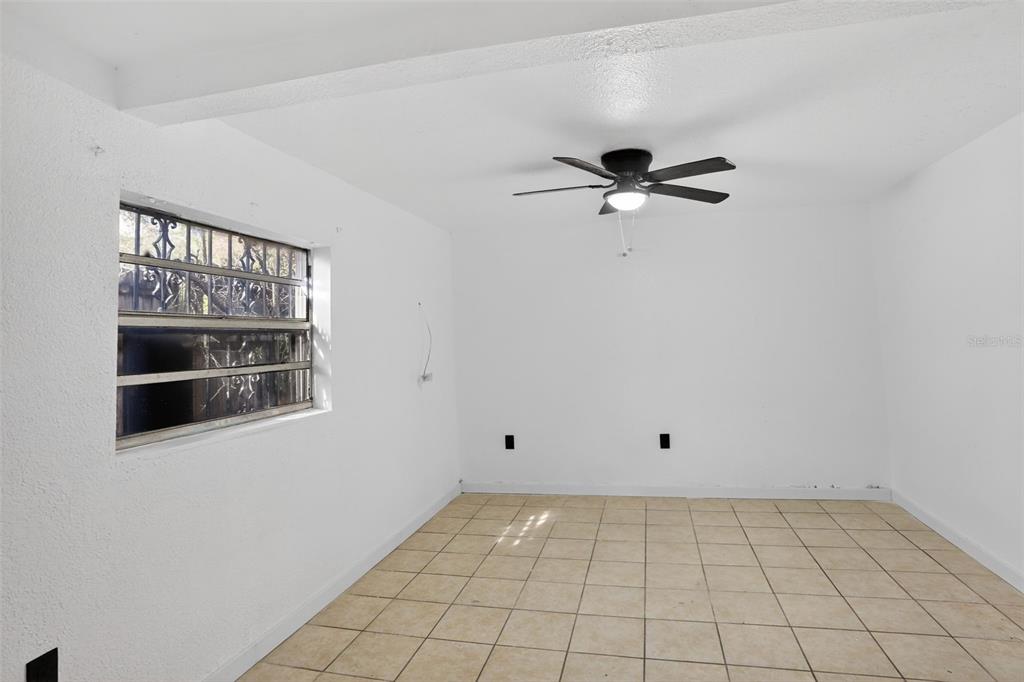 101 West Celeste Street Apopka, FL 32703 - Photo 33 of 47 a view of an empty room with a window