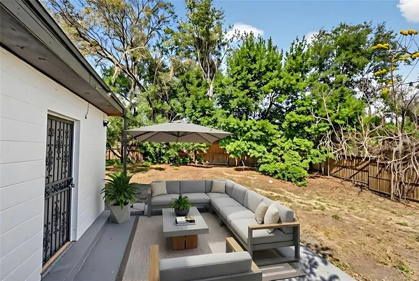 a view of a backyard of the house