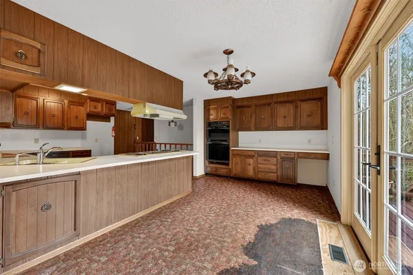 a view of a kitchen with a sink cabinets and window