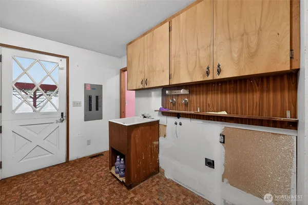 a view of cabinets with wooden floor