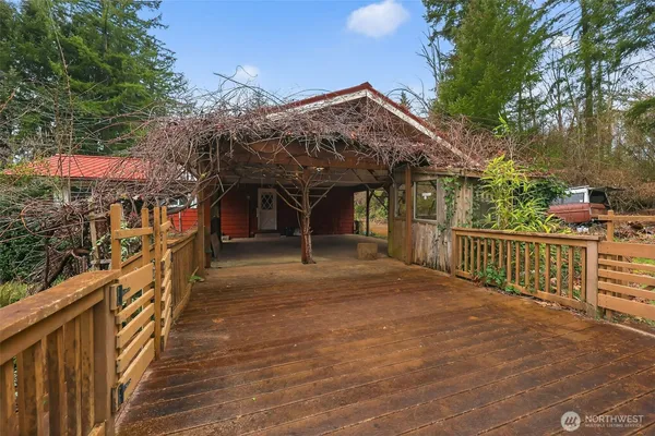 a view of a house with wooden fence