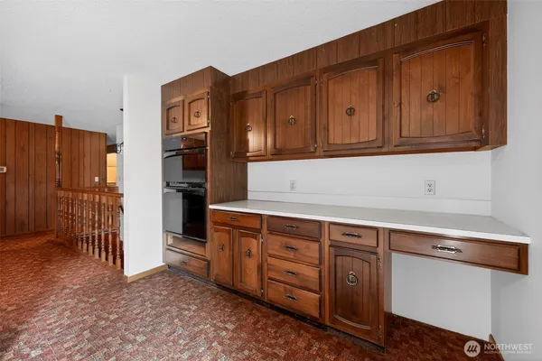 a kitchen with stainless steel appliances granite countertop a refrigerator and cabinets
