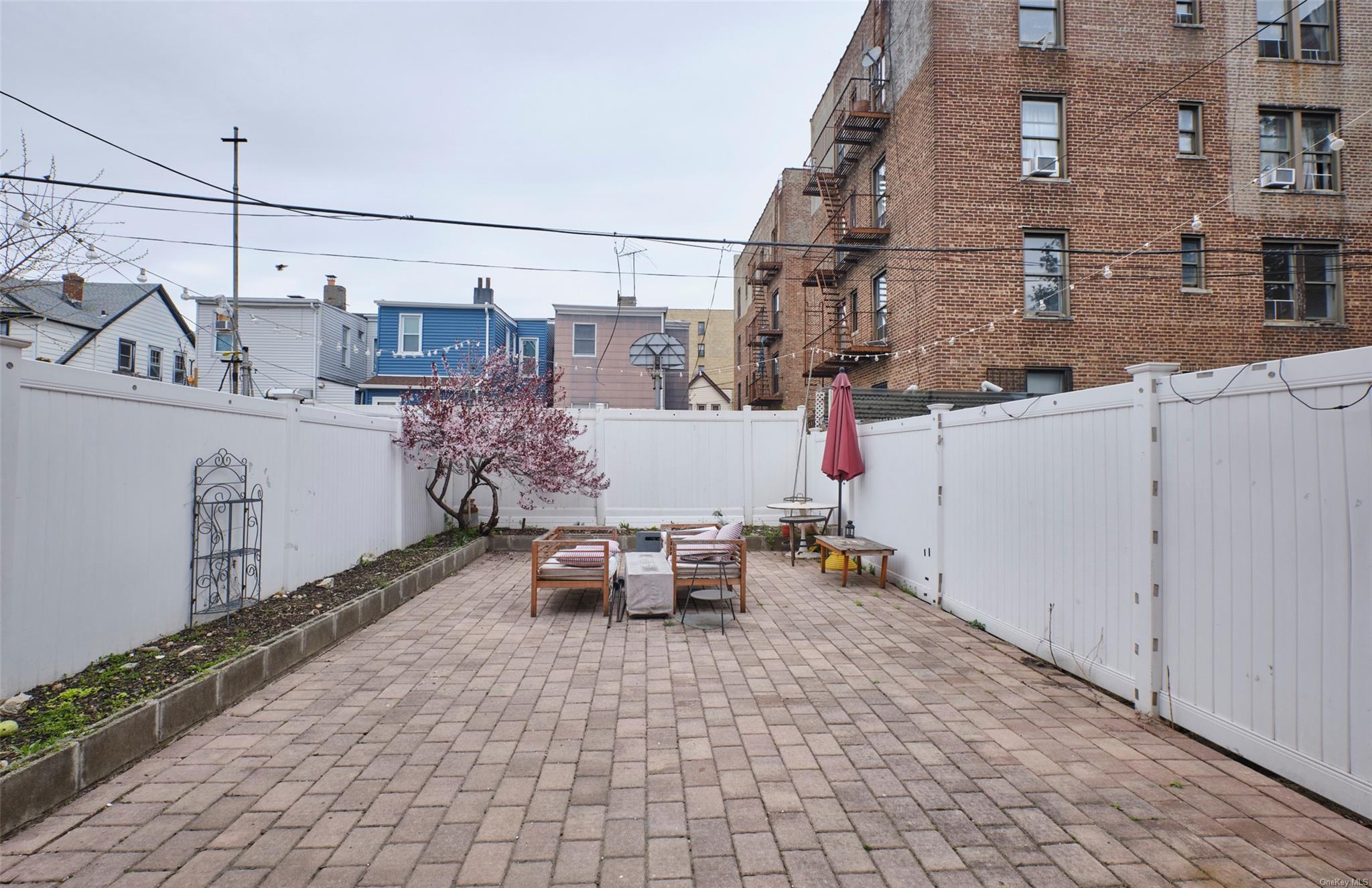 80-19 86th Road Queens, NY 11421 - Photo 20 of 26 a terrace with outdoor seating and city view