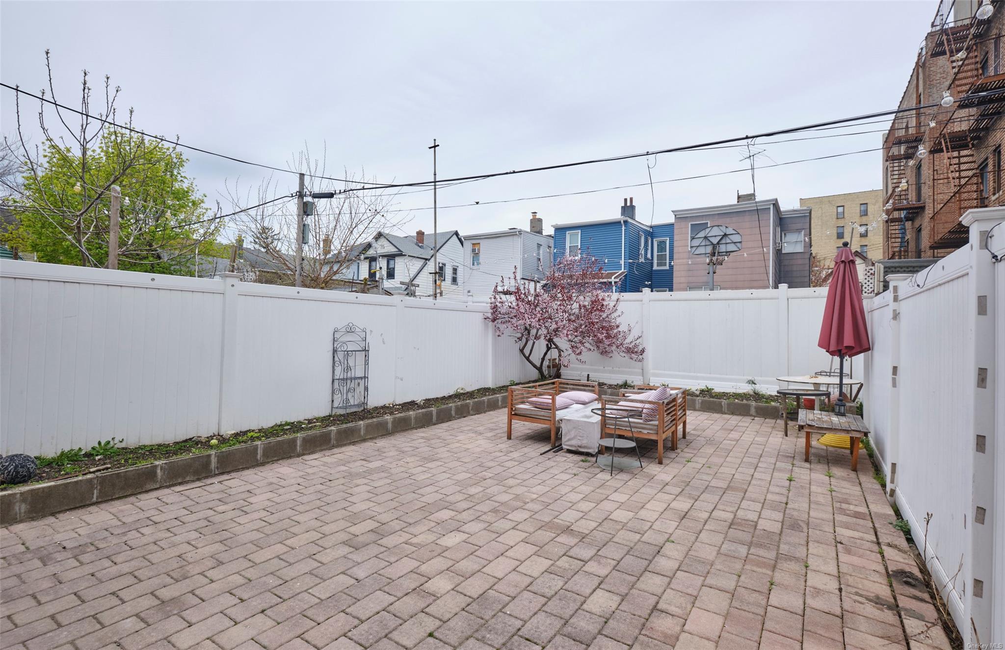 80-19 86th Road Queens, NY 11421 - Photo 22 of 26 a view of a couch in the backyard