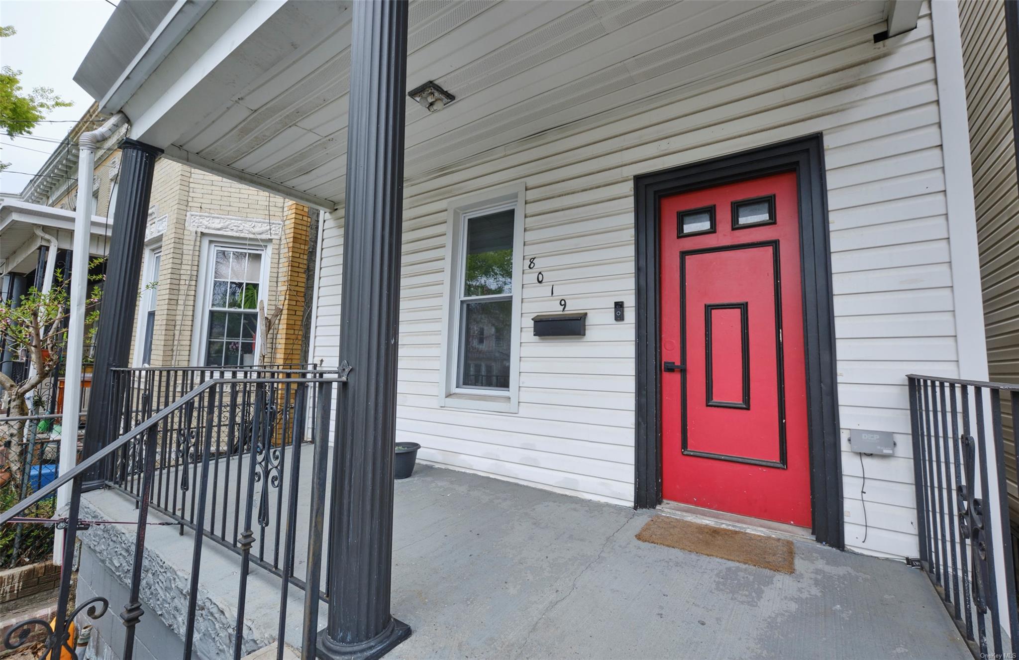 80-19 86th Road Queens, NY 11421 - Photo 3 of 26 a view of a door of the house