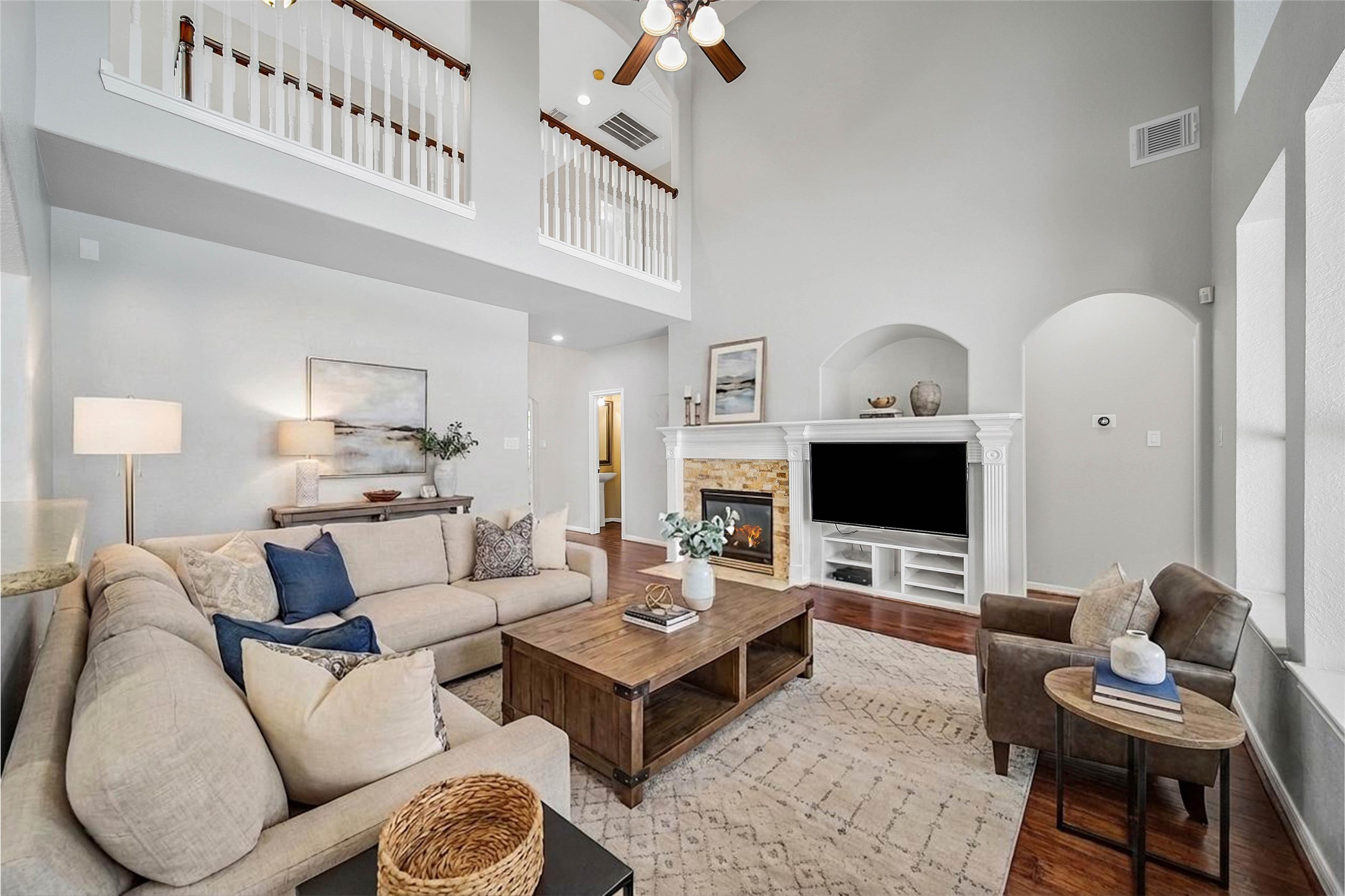 3 Murmuring Creek Place Conroe, TX 77385 - Photo 20 of 50 a living room with furniture a rug and a chandelier