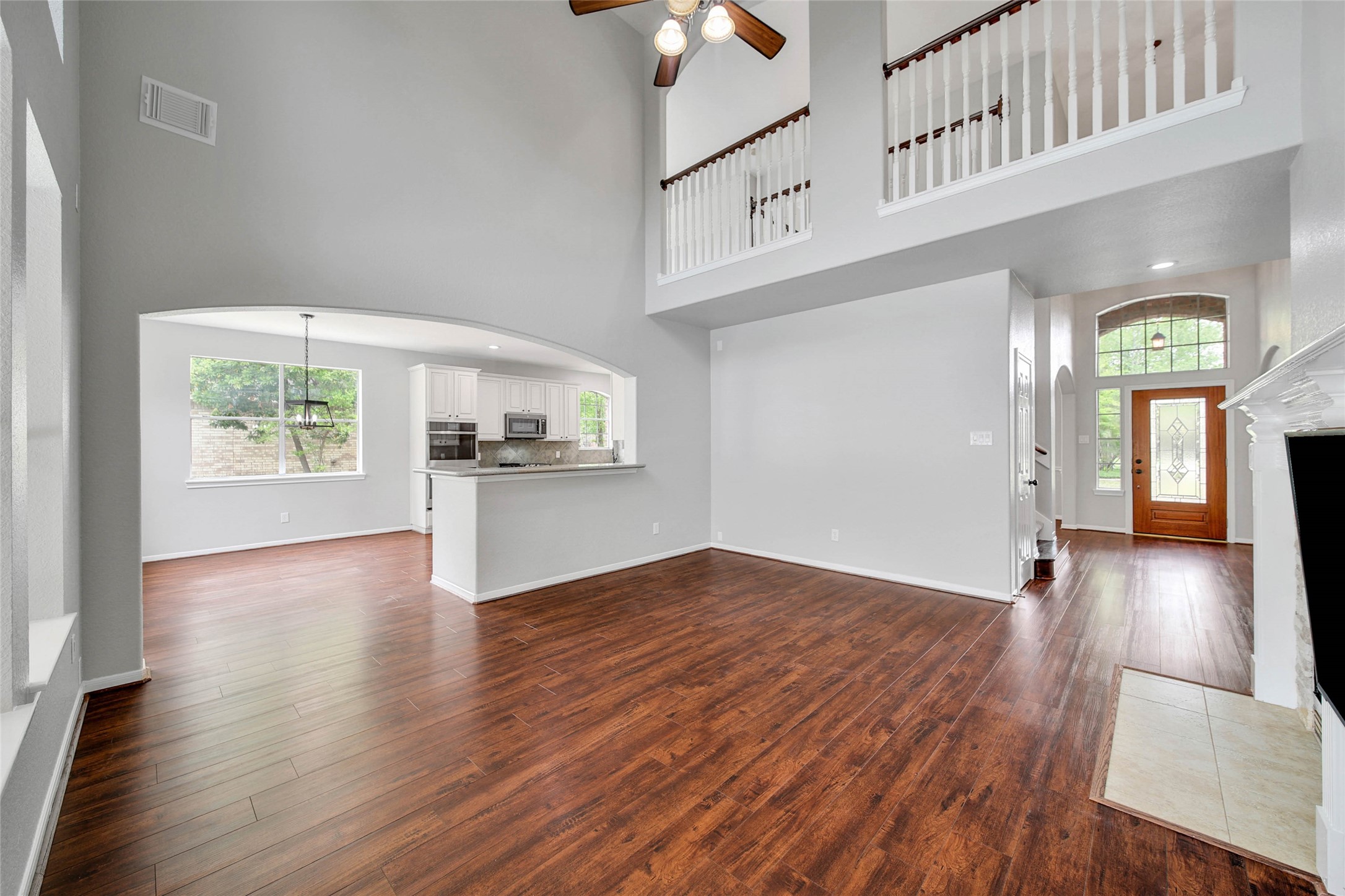3 Murmuring Creek Place Conroe, TX 77385 - Photo 24 of 50 wooden floor in an empty room with a window