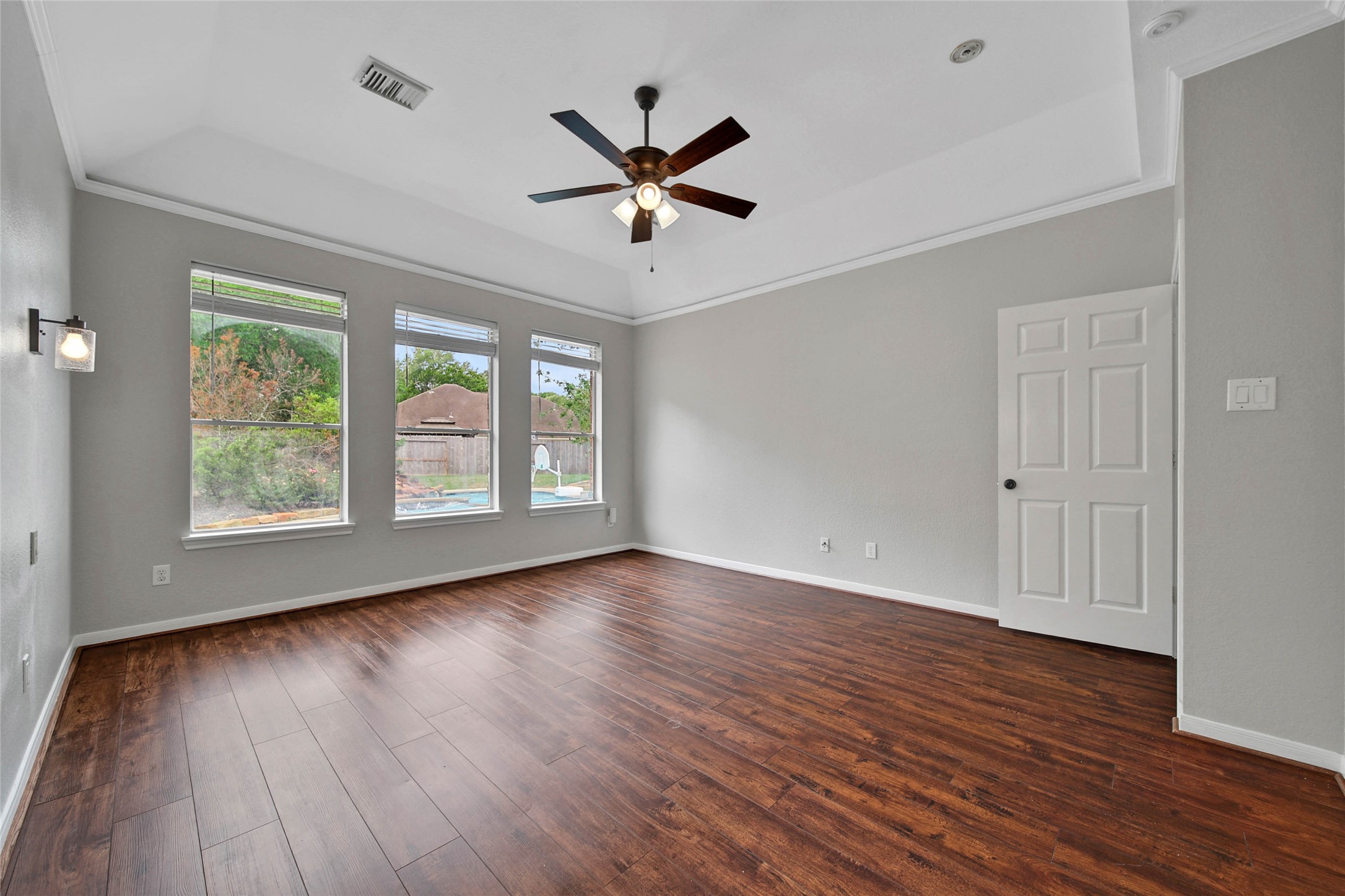 3 Murmuring Creek Place Conroe, TX 77385 - Photo 27 of 50 a view of empty room with wooden floor and fan