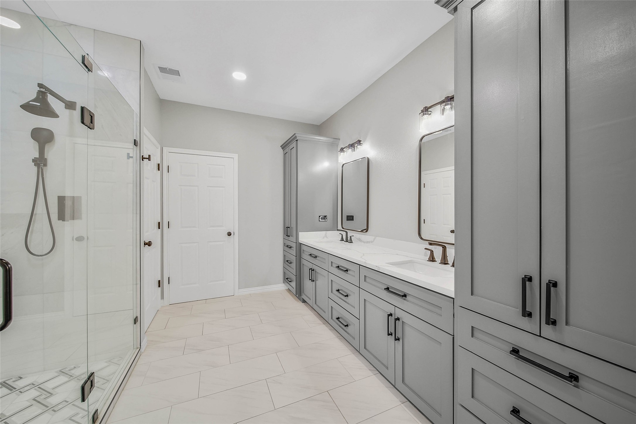 3 Murmuring Creek Place Conroe, TX 77385 - Photo 29 of 50 a bathroom with a double vanity sink mirror and shower