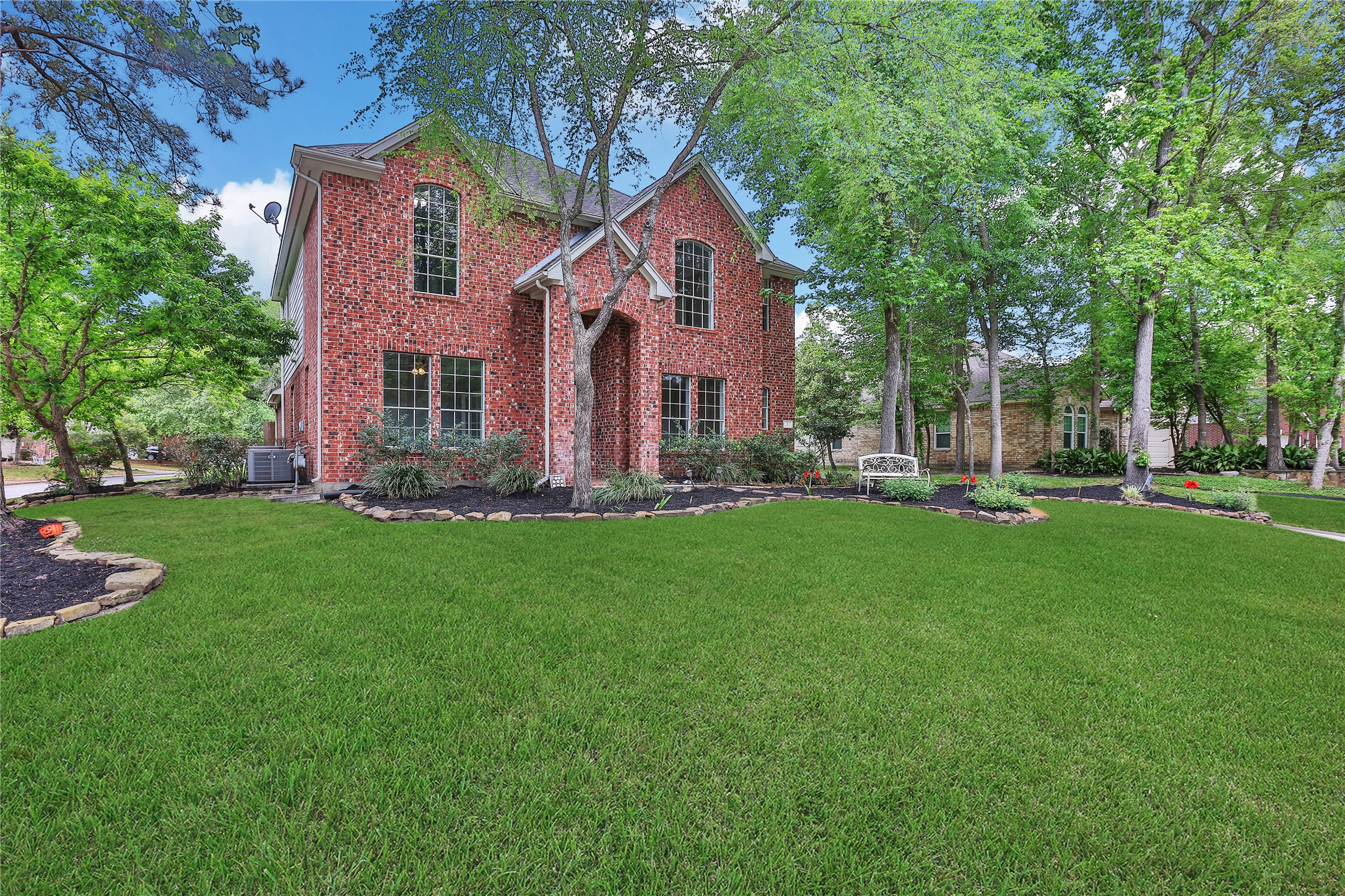 3 Murmuring Creek Place Conroe, TX 77385 - Photo 3 of 50 a front view of house with yard and green space