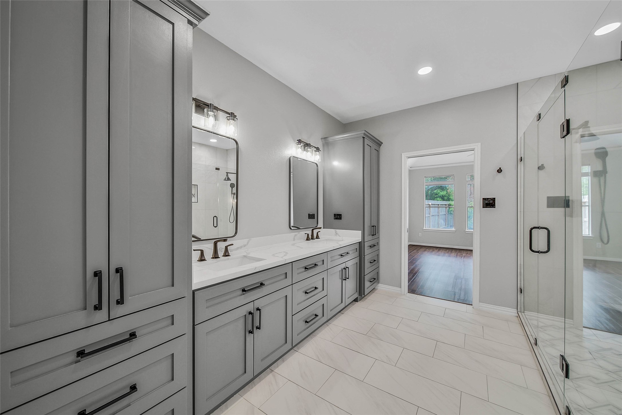 3 Murmuring Creek Place Conroe, TX 77385 - Photo 32 of 50 a spacious bathroom with a granite countertop sink mirror and shower
