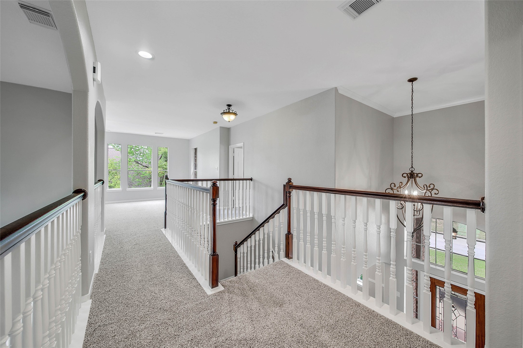 3 Murmuring Creek Place Conroe, TX 77385 - Photo 34 of 50 a view of a hallway with stairs