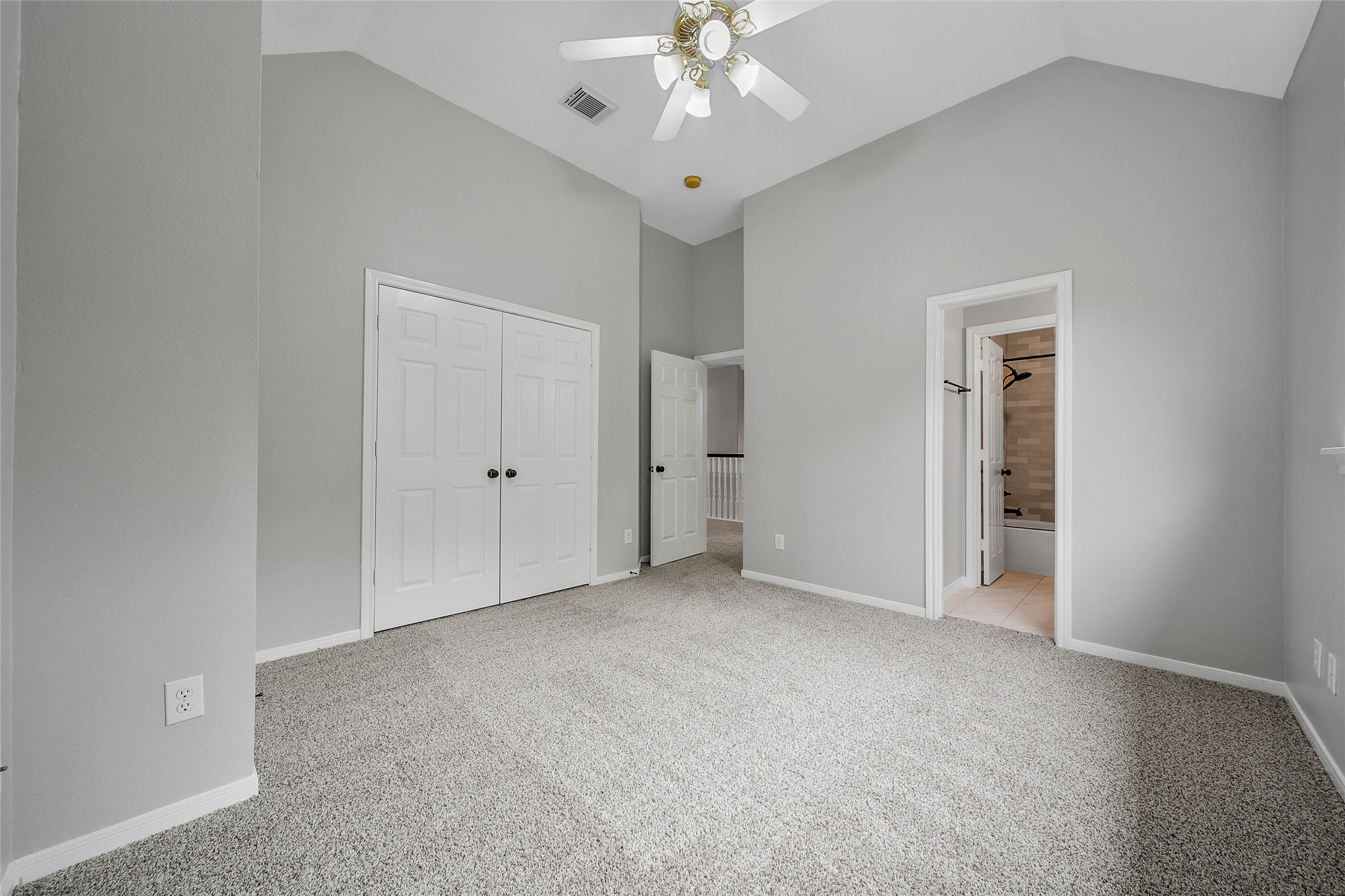 3 Murmuring Creek Place Conroe, TX 77385 - Photo 44 of 50 an empty room with fan and entrance