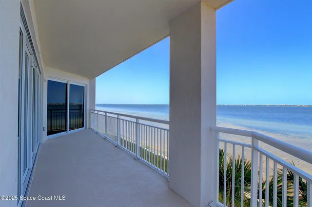 a view of porch with wooden floor and floor to ceiling window