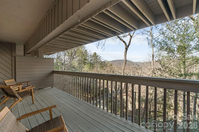 a view of a balcony with furniture