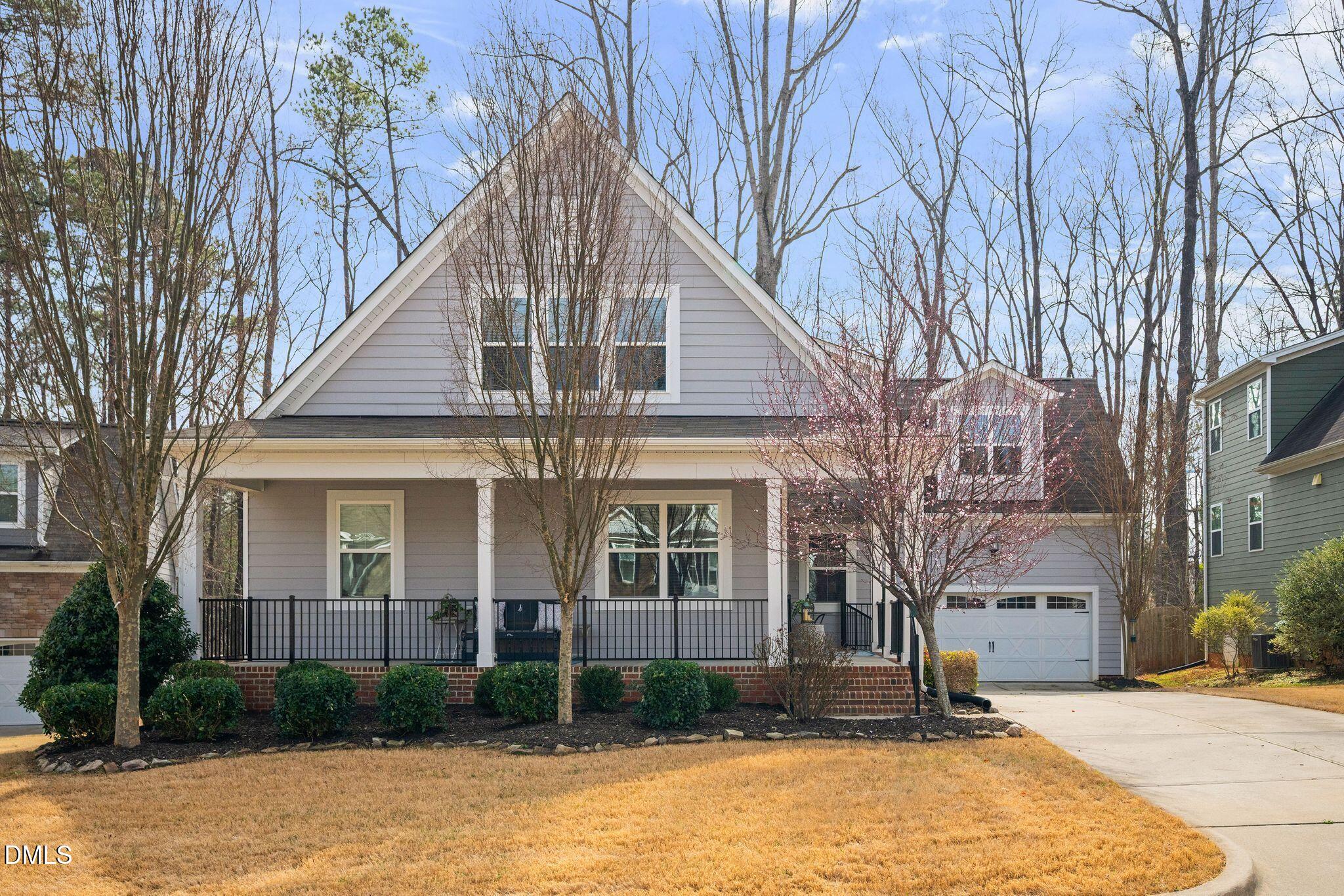 528 Spring Flower Court Cary, NC 27511 - Photo 1 of 51 a front view of a house with a yard