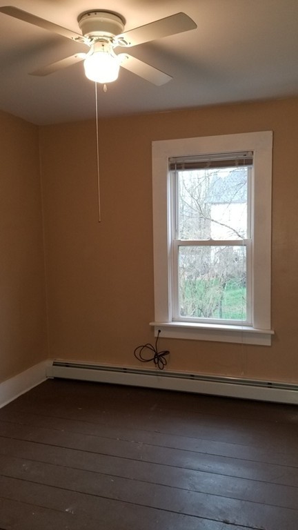 63 Harrington Street, Unit 2 Southbridge, MA 01550 - Photo 11 of 15 a view of a window in an empty room