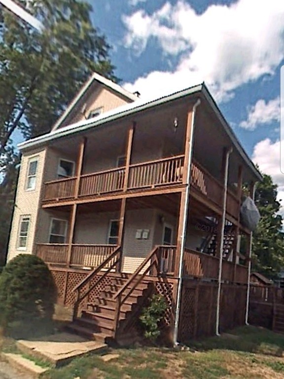 63 Harrington Street, Unit 2 Southbridge, MA 01550 - Photo 12 of 15 a view of a house with a door