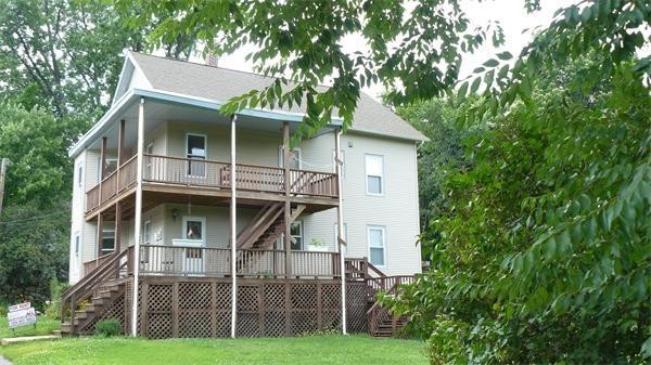 63 Harrington Street, Unit 2 Southbridge, MA 01550 - Photo 13 of 15 a view of a house with a yard