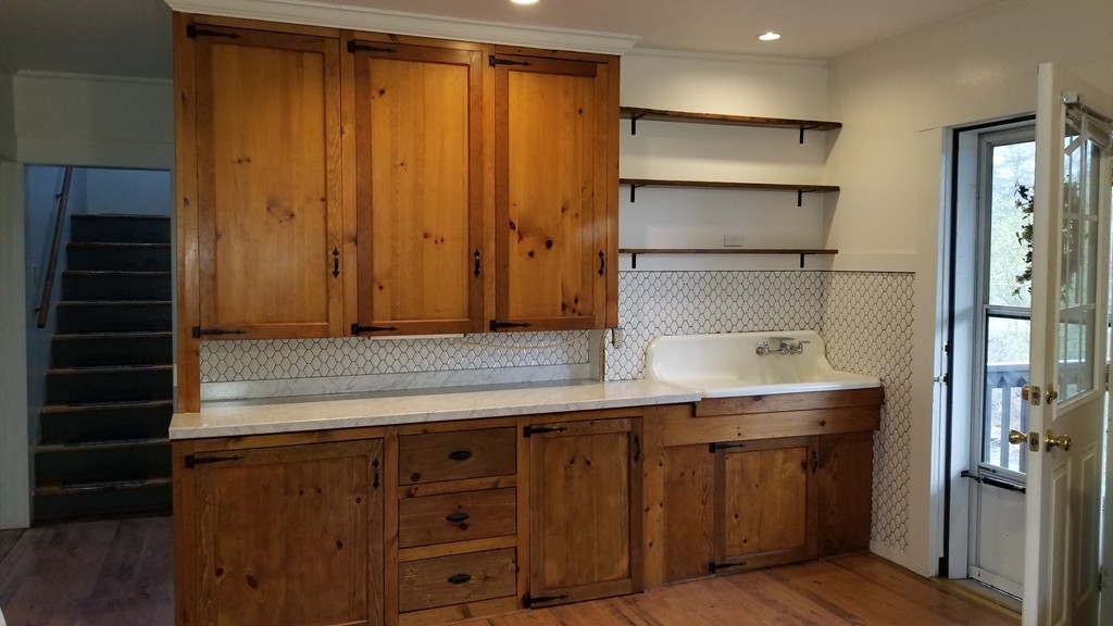 63 Harrington Street, Unit 2 Southbridge, MA 01550 - Photo 5 of 15 a kitchen with a sink and cabinets