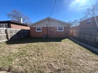 a house view with a backyard space