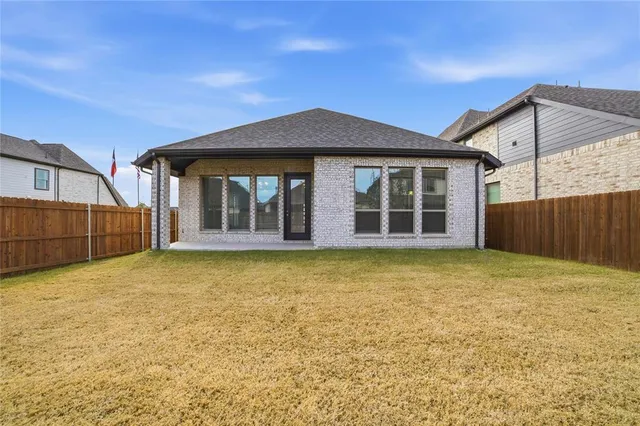 a front view of a house with a large window