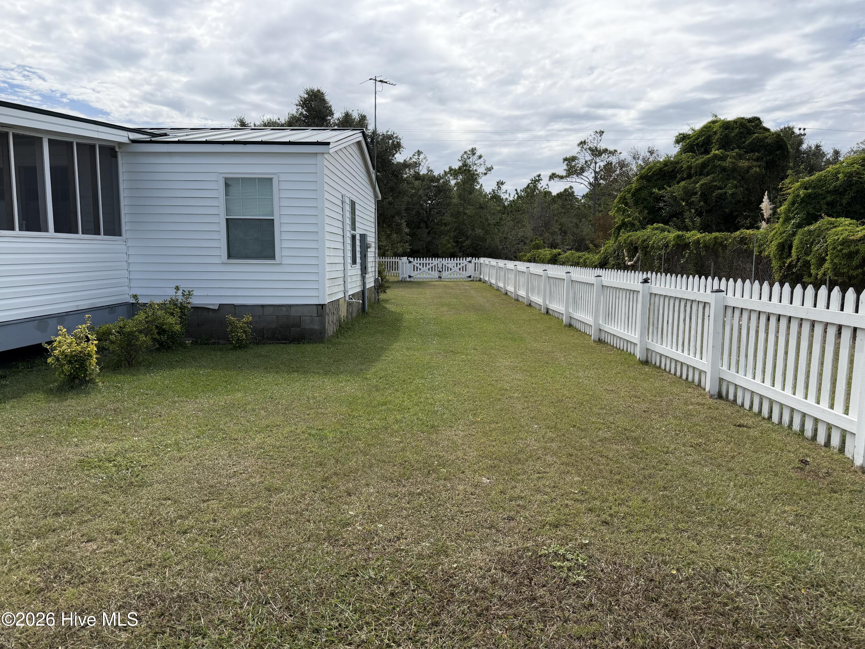 391 Lola Road Cedar Island, NC 28520 - Photo 21 of 34 Side yard