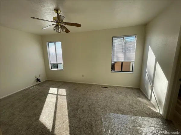 a view of an empty room and a window
