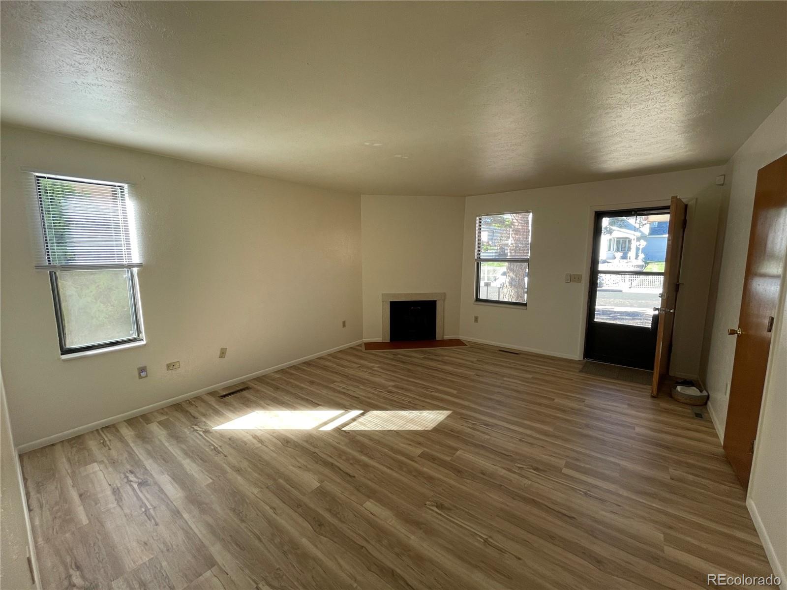 4820 West 88th Place Westminster, CO 80031 - Photo 3 of 21 a view of an empty room and window